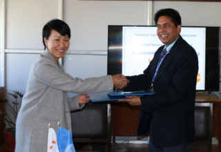Picture depicts the partnership signing between UNFPA and the NHRC