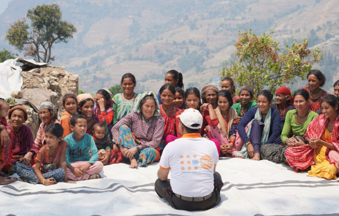 Picture depicts UNFPA engaging with the affected communities in Doti