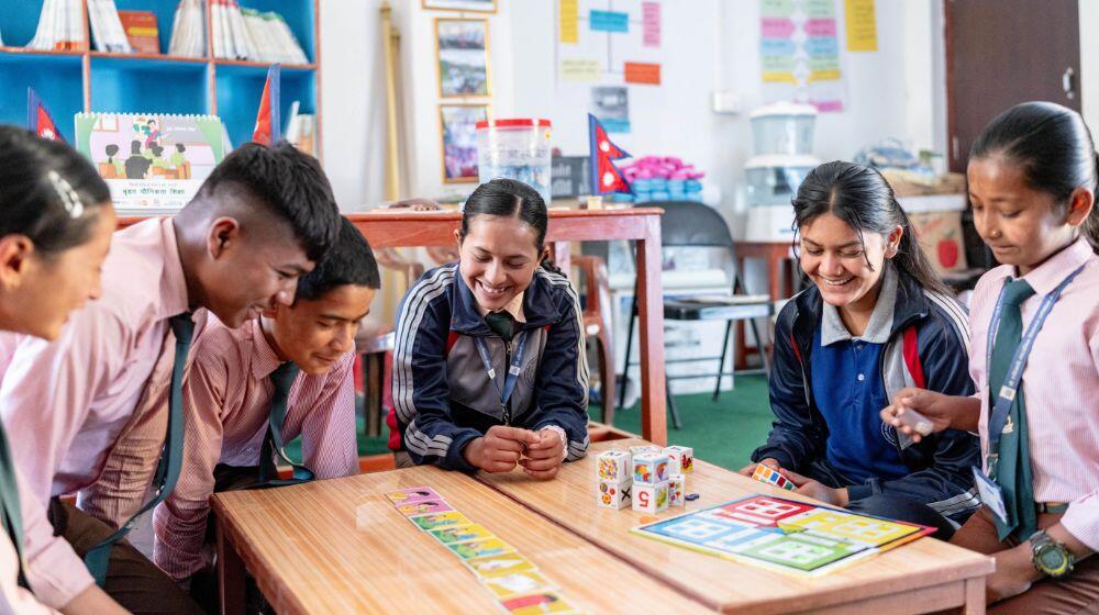 Students sit at an Adolescent Friendly Information Corner