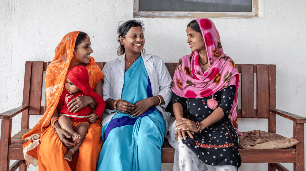 Picture shows Jeevan Kumar Sah engaging with community members