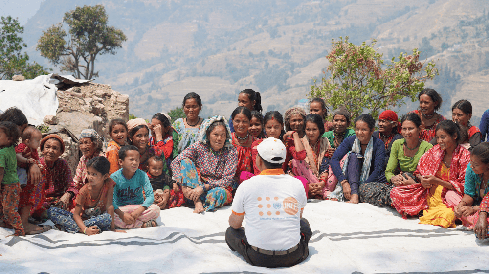 Picture depicts UNFPA engaging with the affected communities in Doti