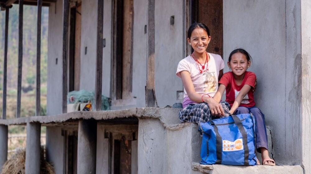  Mother and daughter with a dignity kit in Rukum West.